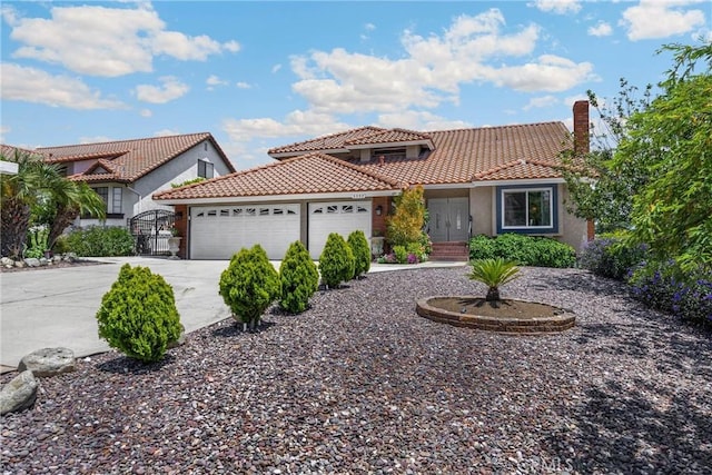5999 Cedar Mountain Dr, Rancho Cucamonga, CA 91737 - mediterranean / spanish-style house with a garage, stucco siding, a tiled roof, and driveway