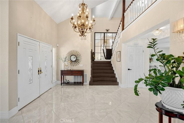 5999 Cedar Mountain Dr, Rancho Cucamonga, CA 91737 - foyer entrance featuring stairs, high vaulted ceiling, a chandelier, and marble finish flooring