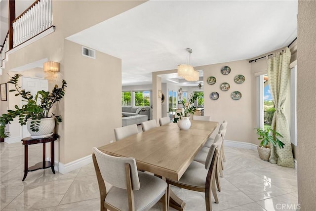 5999 Cedar Mountain Dr, Rancho Cucamonga, CA 91737 - dining room featuring light marble finish flooring and stairs
