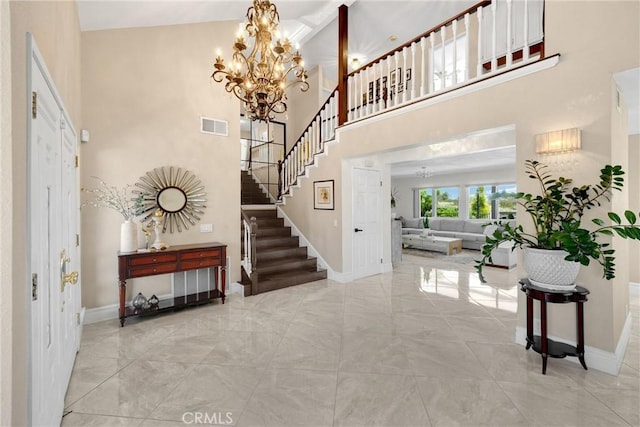5999 Cedar Mountain Dr, Rancho Cucamonga, CA 91737 - foyer entrance featuring a chandelier, stairs, a high ceiling, and marble finish floors