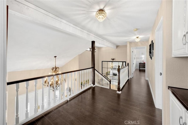 5999 Cedar Mountain Dr, Rancho Cucamonga, CA 91737 - hallway featuring a chandelier, dark wood-style flooring, and an upstairs landing