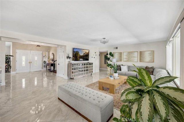 5999 Cedar Mountain Dr, Rancho Cucamonga, CA 91737 - living room featuring light marble finish flooring and baseboards