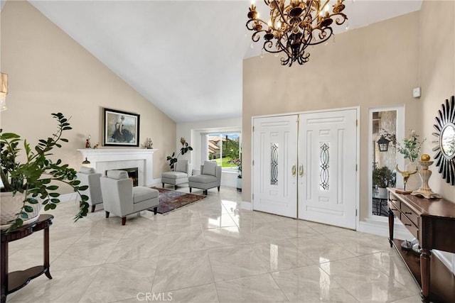 5999 Cedar Mountain Dr, Rancho Cucamonga, CA 91737 - entryway with high vaulted ceiling, light marble finish floors, a chandelier, and a lit fireplace