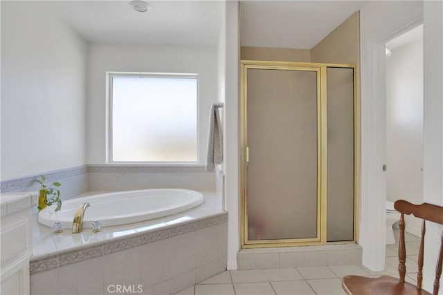 7330 Smoke Tree Rd, Phelan, CA 92371 - bathroom with tile patterned flooring, a garden tub, and a stall shower
