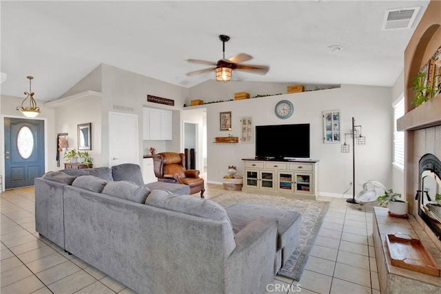 7330 Smoke Tree Rd, Phelan, CA 92371 - living room with vaulted ceiling, light tile patterned flooring, ceiling fan, and healthy amount of natural light