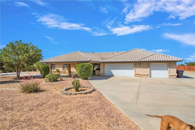7330 Smoke Tree Rd, Phelan, CA 92371 - view of front facade with a garage, driveway, a tile roof, and stucco siding