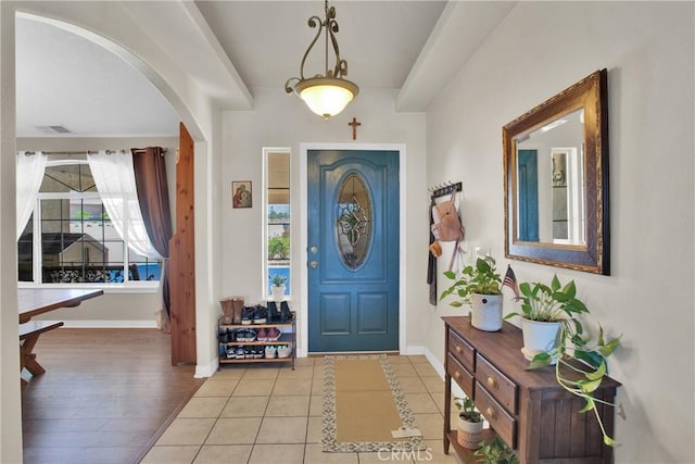 7330 Smoke Tree Rd, Phelan, CA 92371 - foyer entrance with arched walkways and light tile patterned flooring