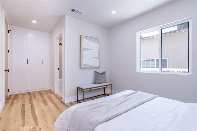 17905 Bullock St, Encino, CA 91316 - bedroom with light wood-style floors and recessed lighting