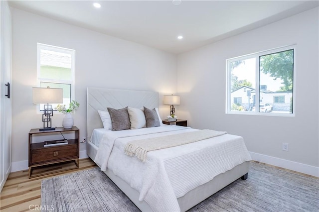 17905 Bullock St, Encino, CA 91316 - bedroom with light wood finished floors and recessed lighting
