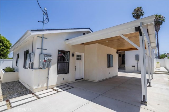 17905 Bullock St, Encino, CA 91316 - back of house featuring stucco siding and a patio area