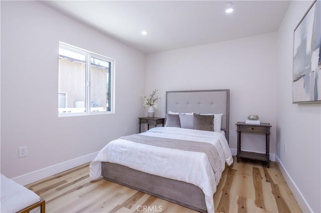 17905 Bullock St, Encino, CA 91316 - bedroom with wood finished floors and recessed lighting