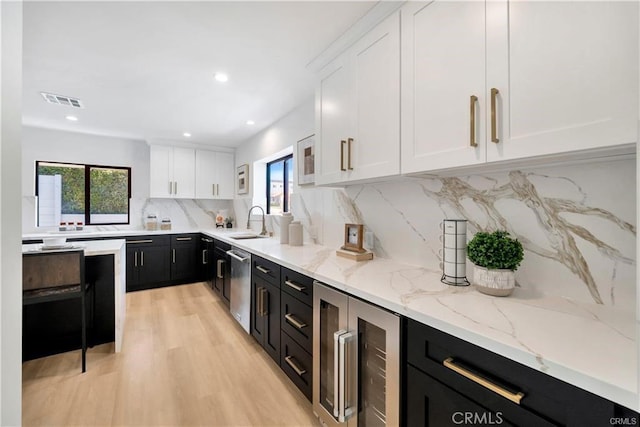 1603 Sunnyside, San Pedro, CA 90732 - kitchen with beverage cooler, dark cabinets, white cabinets, healthy amount of natural light, and recessed lighting