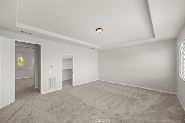 36845 Gemina Ave, Murrieta, CA 92563 - unfurnished bedroom with a raised ceiling, carpet, and multiple windows