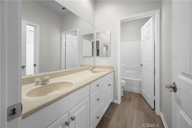 36845 Gemina Ave, Murrieta, CA 92563 - bathroom featuring double vanity and wood finished floors