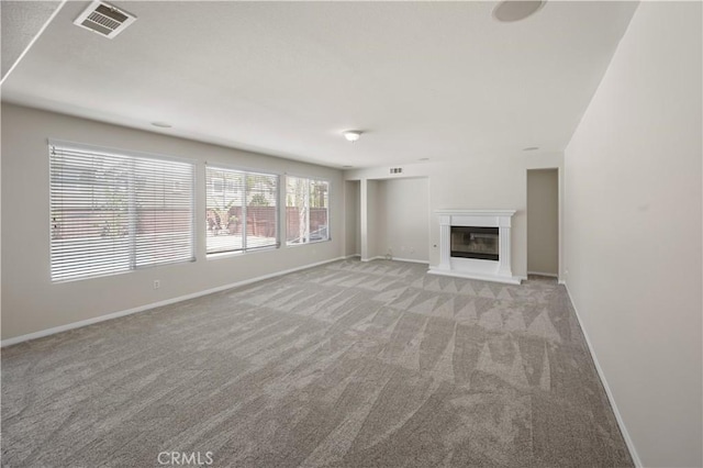 36845 Gemina Ave, Murrieta, CA 92563 - unfurnished living room with light carpet and a glass covered fireplace