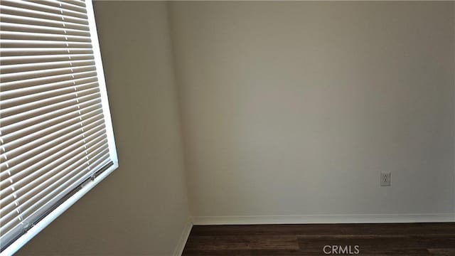 9019 Fremont Ct, Oak Hills, CA 92344 - unfurnished room featuring baseboards and dark wood finished floors