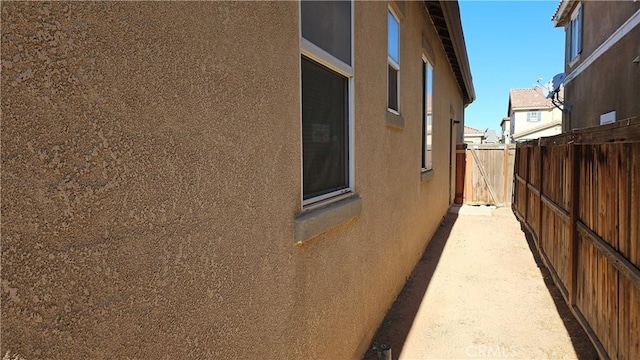 9019 Fremont Ct, Oak Hills, CA 92344 - view of home's exterior featuring stucco siding