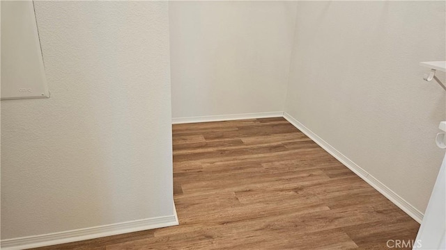9019 Fremont Ct, Oak Hills, CA 92344 - walk in closet featuring wood finished floors