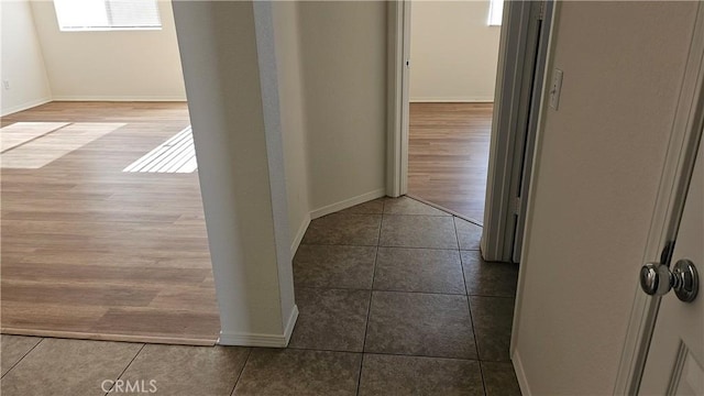 9019 Fremont Ct, Oak Hills, CA 92344 - hallway with tile patterned flooring and baseboards