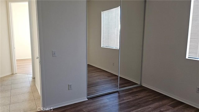 9019 Fremont Ct, Oak Hills, CA 92344 - unfurnished bedroom with wood finished floors and a closet