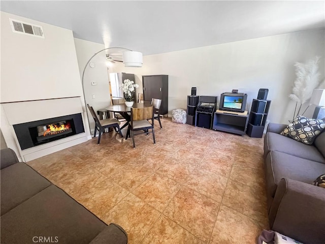 400 S Flower St Unit 131, Orange, CA 92868 - living area featuring a glass covered fireplace and light tile patterned floors