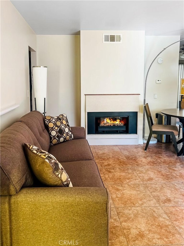 400 S Flower St Unit 131, Orange, CA 92868 - living area featuring a glass covered fireplace