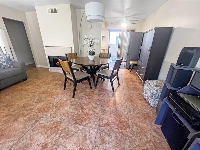 400 S Flower St Unit 131, Orange, CA 92868 - dining area with ceiling fan, a fireplace, and light tile patterned flooring