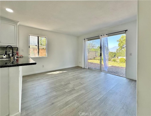 2568 Highgate Ct, Chino Hills, CA 91709 - unfurnished living room with plenty of natural light, light wood-style floors, and recessed lighting