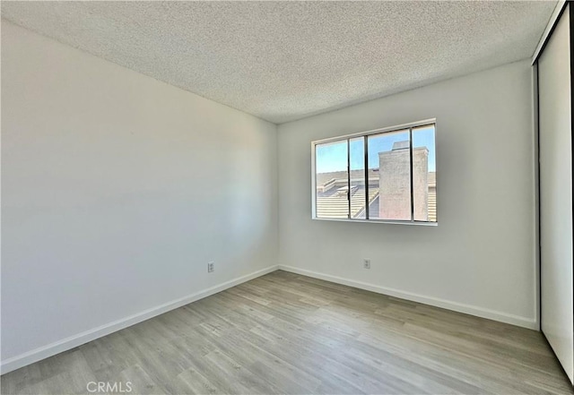 2568 Highgate Ct, Chino Hills, CA 91709 - empty room featuring a textured ceiling and wood finished floors