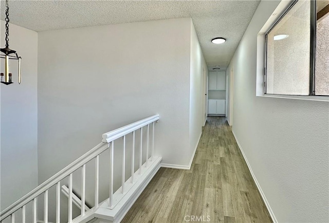 2568 Highgate Ct, Chino Hills, CA 91709 - hall with wood finished floors and a textured ceiling