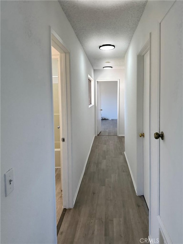 2568 Highgate Ct, Chino Hills, CA 91709 - corridor featuring a textured ceiling and wood finished floors