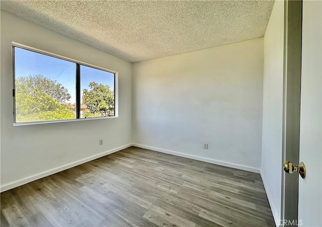 2568 Highgate Ct, Chino Hills, CA 91709 - empty room featuring wood finished floors and a textured ceiling