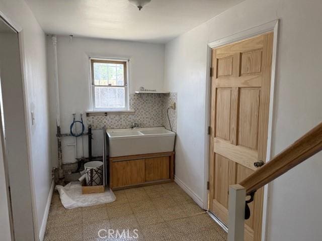 2208 W Olympic Blvd, Montebello, CA 90640 - laundry room featuring a sink and light flooring