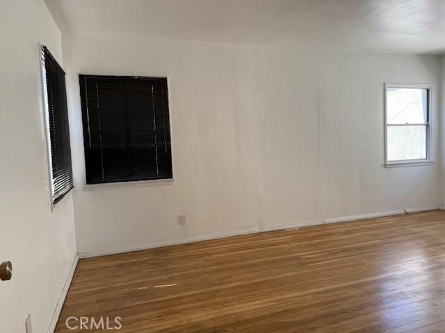 2208 W Olympic Blvd, Montebello, CA 90640 - spare room with wood finished floors and baseboards