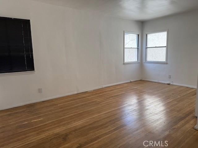 2208 W Olympic Blvd, Montebello, CA 90640 - spare room with wood finished floors and baseboards