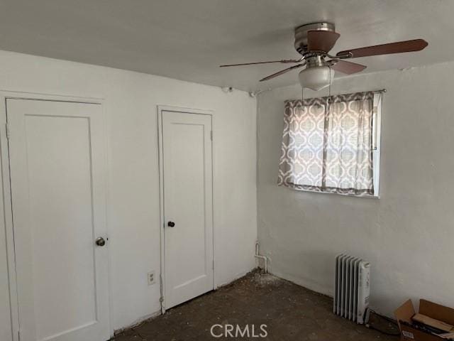 2208 W Olympic Blvd, Montebello, CA 90640 - unfurnished bedroom with radiator and ceiling fan