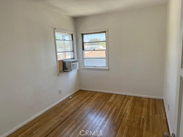 2208 W Olympic Blvd, Montebello, CA 90640 - unfurnished room with wood finished floors and cooling unit