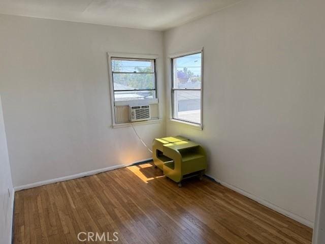 2208 W Olympic Blvd, Montebello, CA 90640 - spare room with wood finished floors and cooling unit