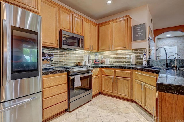 1430 Vallejo Mills St, Chula Vista, CA 91913 - kitchen featuring stainless steel appliances, backsplash, light tile patterned floors, recessed lighting, and arched walkways