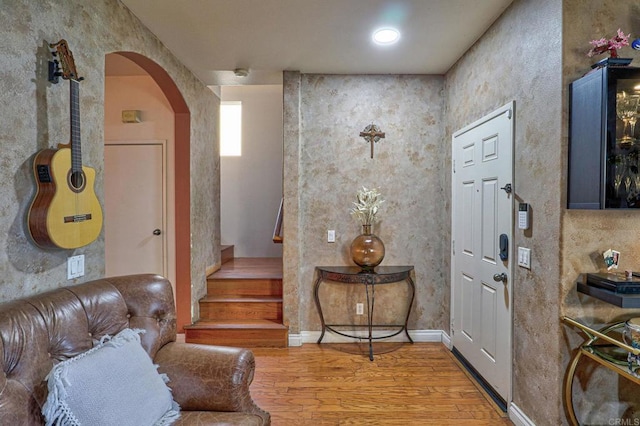 1430 Vallejo Mills St, Chula Vista, CA 91913 - entrance foyer with arched walkways, light wood-style flooring, and stairs
