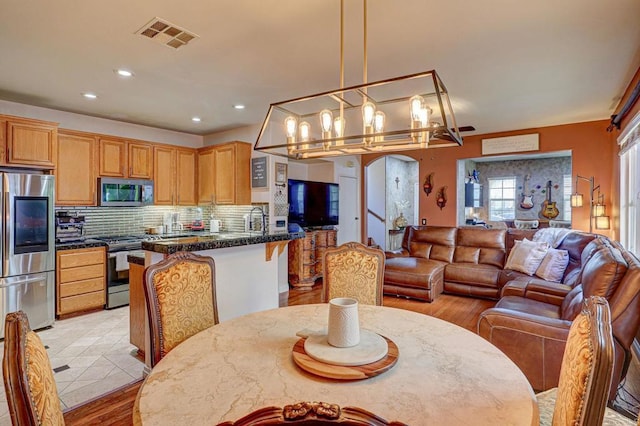1430 Vallejo Mills St, Chula Vista, CA 91913 - dining area with a chandelier, recessed lighting, and light wood finished floors