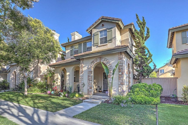 1430 Vallejo Mills St, Chula Vista, CA 91913 - view of front of house with covered porch, stone siding, stucco siding, and a chimney