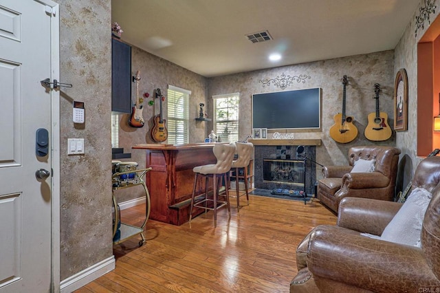 1430 Vallejo Mills St, Chula Vista, CA 91913 - living room with wood-type flooring, a glass covered fireplace, and a dry bar
