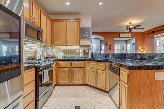 1430 Vallejo Mills St, Chula Vista, CA 91913 - kitchen with stainless steel appliances, decorative backsplash, a ceiling fan, and recessed lighting