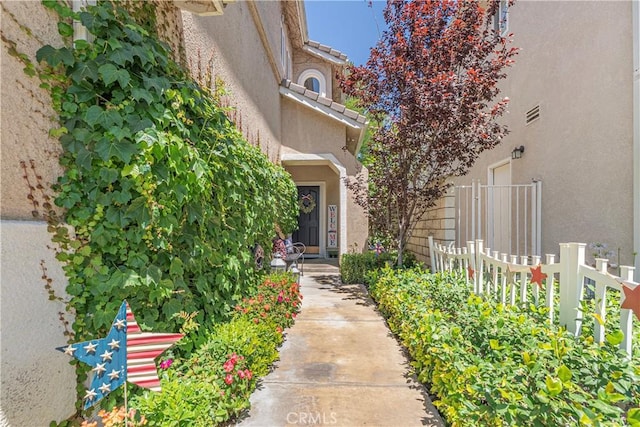 25525 Fitzgerald Ave, Stevenson Ranch, CA 91381 - view of exterior entry with stucco siding