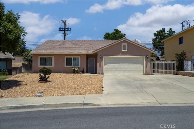 856 Liam Way, Beaumont, CA 92223 - ranch-style house with an attached garage, a tile roof, stucco siding, and driveway