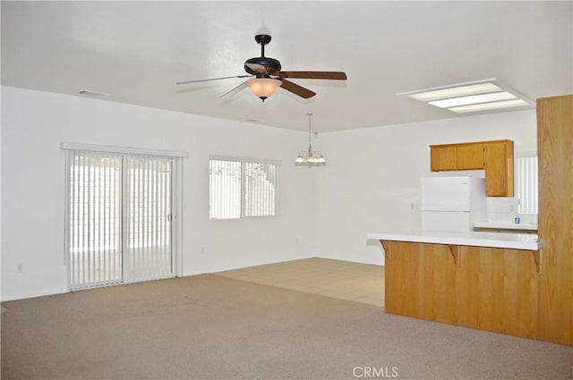 856 Liam Way, Beaumont, CA 92223 - unfurnished living room with ceiling fan, light colored carpet, and a chandelier