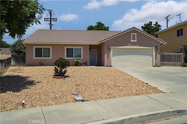 856 Liam Way, Beaumont, CA 92223 - ranch-style house with a tile roof, an attached garage, concrete driveway, and stucco siding