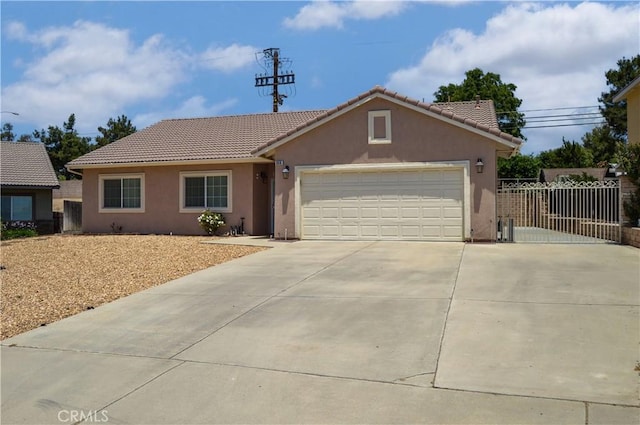 856 Liam Way, Beaumont, CA 92223 - single story home featuring driveway, stucco siding, a tile roof, and a garage