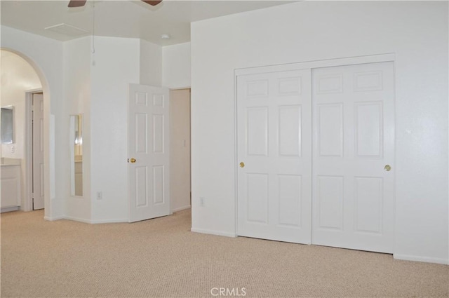 856 Liam Way, Beaumont, CA 92223 - unfurnished bedroom with arched walkways, carpet floors, a closet, and ceiling fan